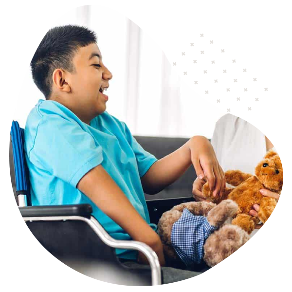 Smiling child in wheelchair with caregiver – NDIS Personal Assistance Melbourne